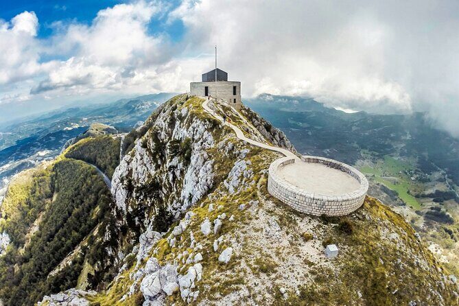 Ride the Kotor Cable Car ( Njegusi, Lovcen and Kotor Cable car) - Lovćen National Park and the Petar II mausoleum: steps, gold, and granite scale